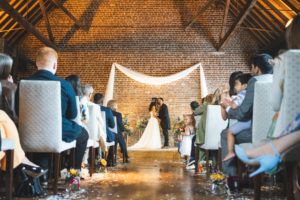 Bride and Groom’s first kiss at Cooling Castle Barn