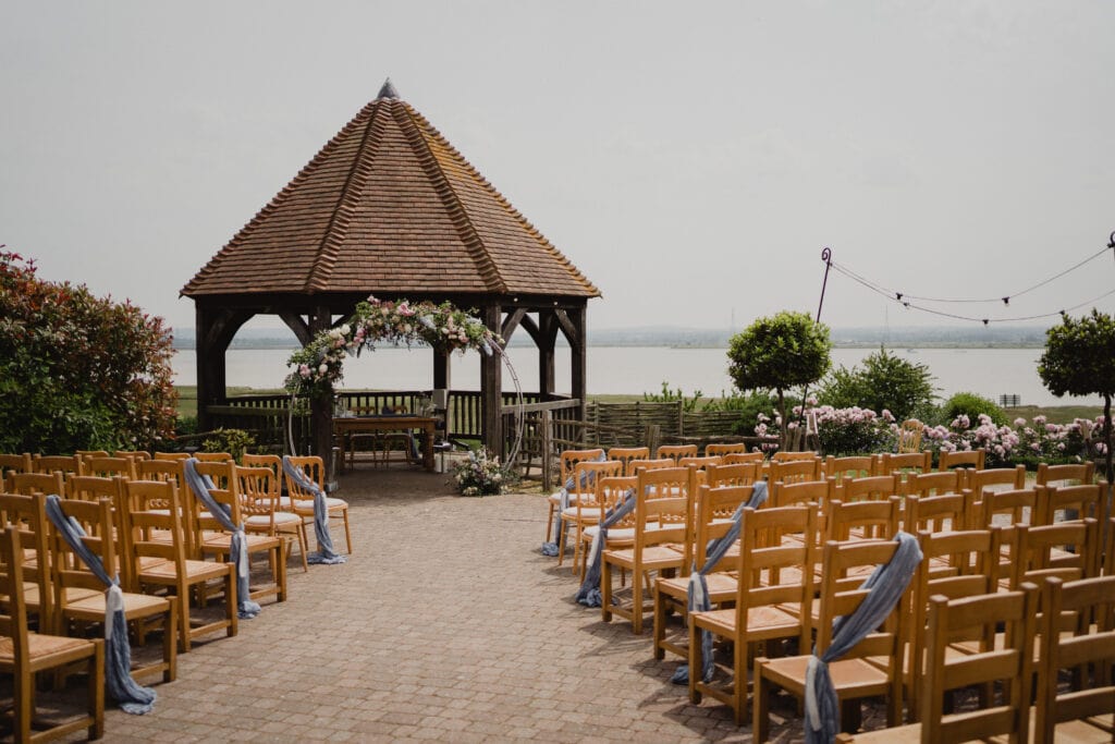 Outdoor ceremony location at The Ferry House in Harty looking over the river