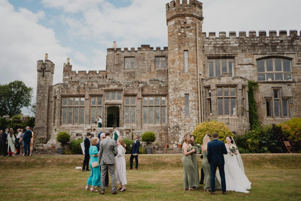 Guests mingling outside Wadhurst Castle in East Sussex